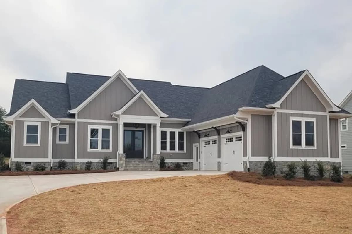 Ratcliff Properties finished custom home with clean lawn and landscape beds